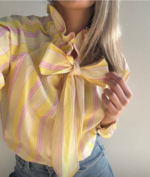 Camisa amarilla rallas