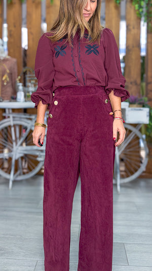Pantalón burdeos flor